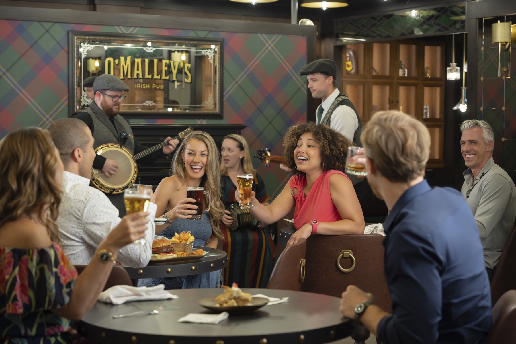 Guests enjoying food and drinks at O'Malley's
